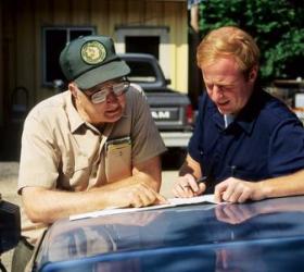 Forester consulting with landowner
