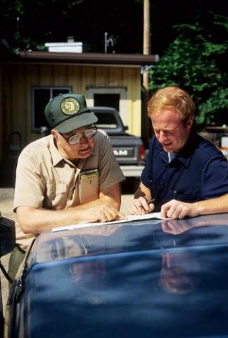 Forester consulting with landowner